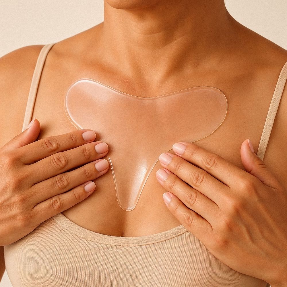 Close up of woman wearing reusable chest patch for wrinkle-smoothing treatment, targeting chest creases, sleep lines and cleavage lines – Bare Intent minimalist skincare