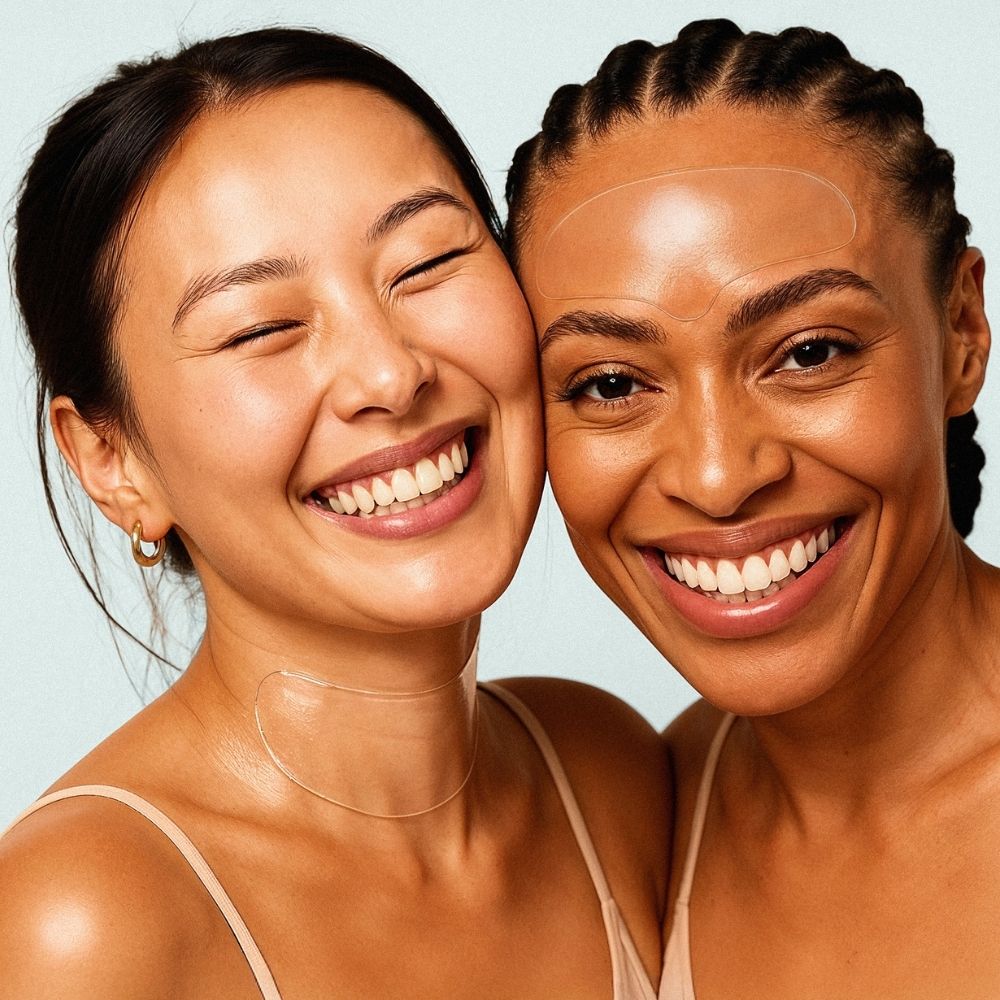 Group of women smiling while wearing Bare Intent forehead and neck reusable anti-wrinkle patches for wrinkle-smoothing treatment